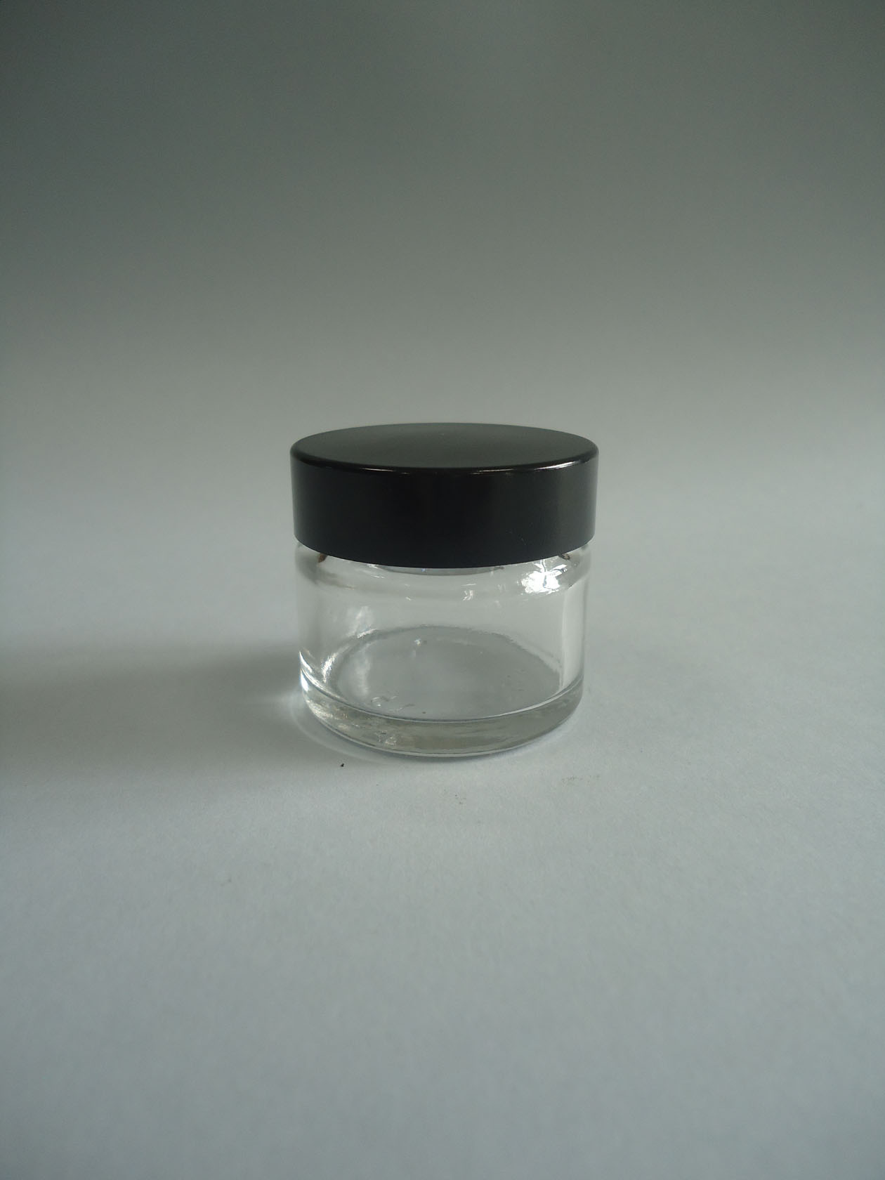 Bote vidrio tapa baquelita negra  15 ml. transparente